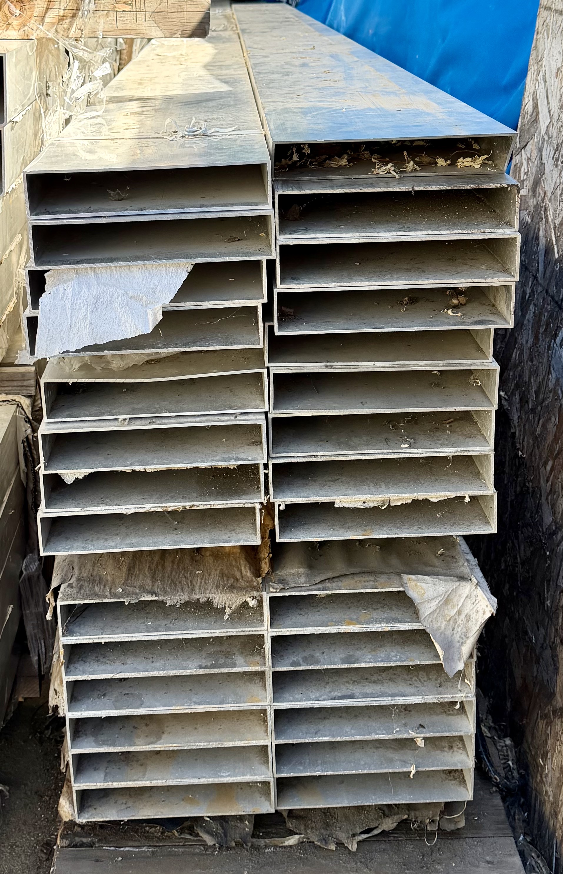 Full stack of 29 pieces of 2 by 10-inch aluminum rectangular tube as stored